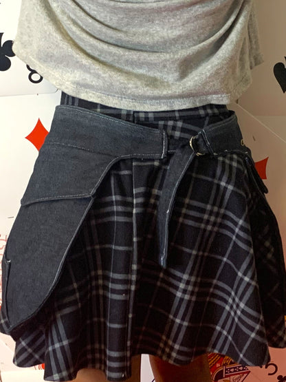 a back view of someone wearing a pair of midnight denim pockets in front of a background covered in playing cards
