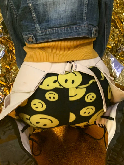 A close-up of someone wearing a pair of off-white pockets, highlighting the adjustable strap.
